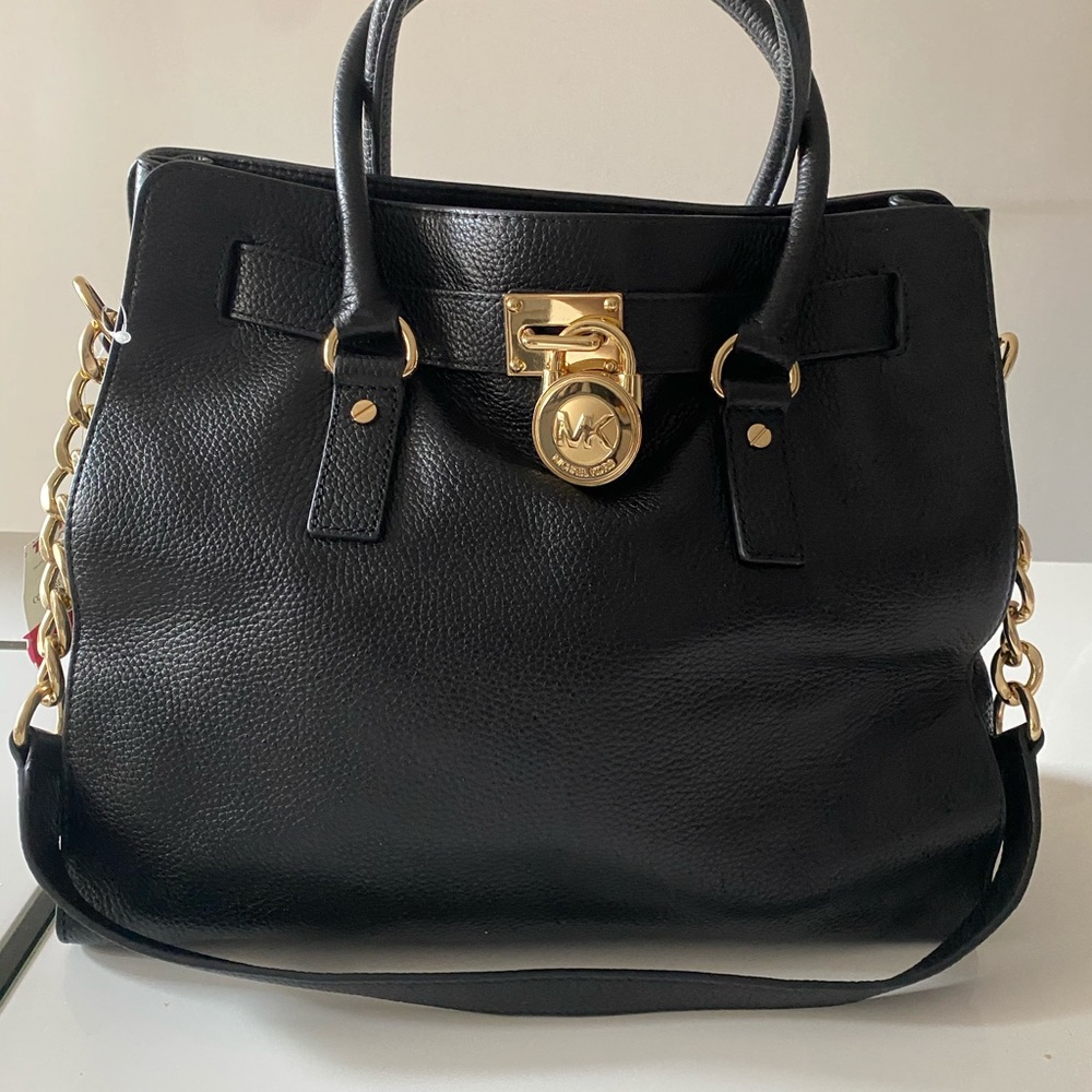 Black Micheal Kors bag with good chain.